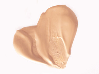 Foundation smear on a white background. A speck of makeup isolated.
