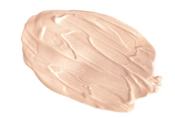 Foundation smear on a white background. A speck of makeup isolated.
