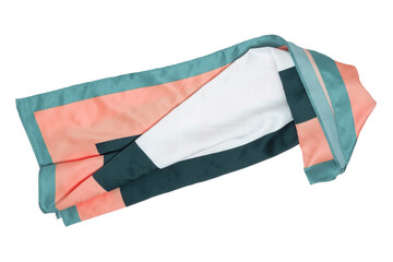 Silk scarf isolated. Closeup of a beautifully folded multicolored blue orange white and black silk scarf or headscarf isolated on a white background.