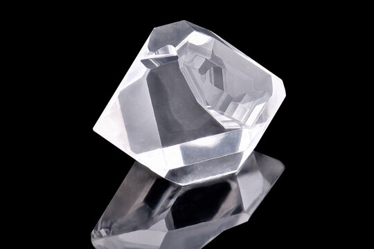 Amazing hexagonal shiny Diamond or herkimer crystal isolated on black background. Sample of Little Rich Luxury Brilliant Diamond stone specimen closeup macro. 