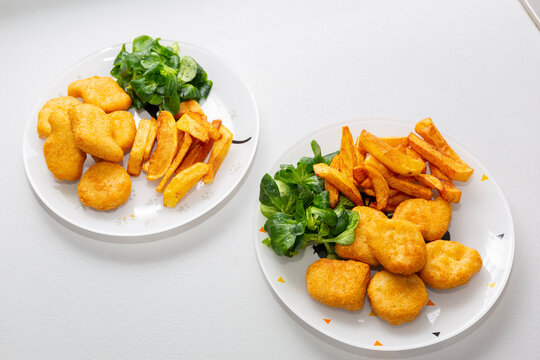 Chicken Nuggets With French Fries And Salad For Kids Menu.