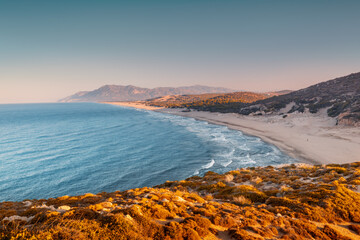 Morning view of the Mediterranean seacoast at the Patara beach during high tide with waves. High...