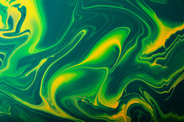 Obraz premium Colorful green and yellow marble abstract backround.Make up concept.Beautiful stains of liquid nail laquers.Fluid art,pour painting technique.Good as digital decor,copy space.Horizontal photography.