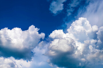 Naklejka na ściany i meble Blue sky with white clouds in sunny summer day.