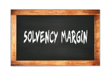 SOLVENCY  MARGIN text written on wooden frame school blackboard.