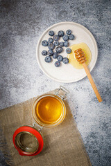 Fresh berries (blueberries and raspberries) with honey