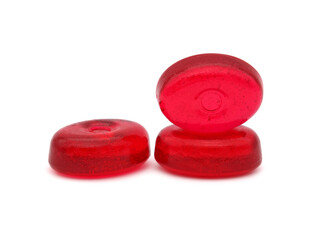 Red fruit hard candy isolated on white 