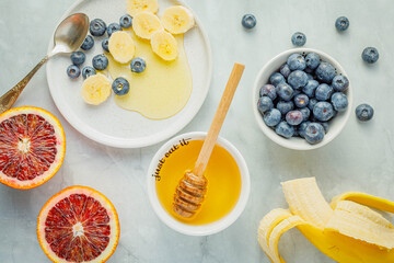 Fresh berries (blueberries and raspberries) with honey