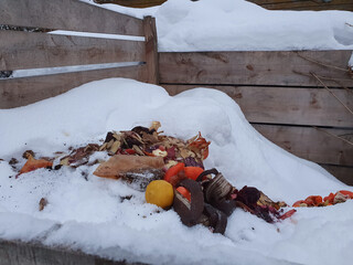 Wood compost bin in winter, food waste composted. Let's protect nature concept, ecological...