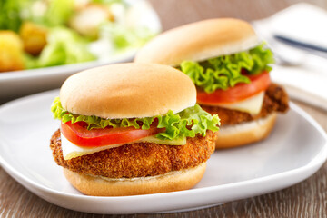 Mini Crispy Chicken Burger with Lettuce Tomato and Cheese.