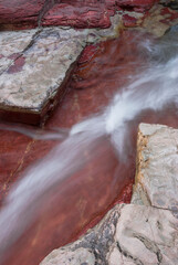 Canada, Waterton-Glacier International Peace Park. Abstract design of the rock formations and streambed of Red Rock Canyon
