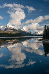 Canada, Alberta. Snow and cloud covered peaks surrounding Maligne Lake, Jasper National Park.