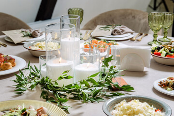 Beautiful ablaze candle, luxury catering, wedding table.