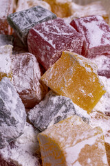 multicolored turkish delight in powdered sugar close-up