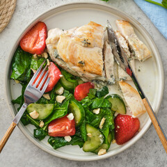 Fried Chicken Breast with Fresh Strawberry Cucumber Salad.