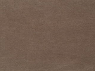Flat, dark brown denim material is shown in a closeup view.