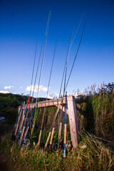Fototapeta premium Fly rods and reels leaning against a post at a guide camp in Alaska. 