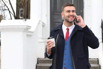 Stylish Caucasian businessman calling during coffee break