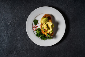 Avocado on sliced toasted bread, top view