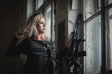 Obraz na płótnie Canvas Concept of super special agent girl with a rifle.