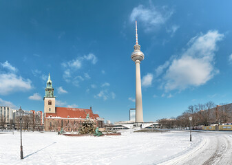Berlin under snow. Alexanderplatz with famous TV tower. Berlin under snow. Panoramic image with...