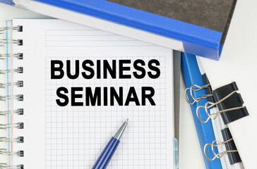 Among the documents, folders, a notebook with the inscription - BUSINESS SEMINAR