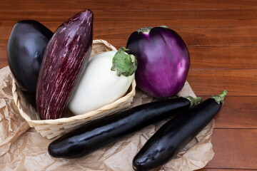 Mixed eggplant on wooden table. Variety of eggplant.