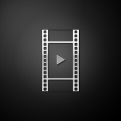 Silver Play Video icon isolated on black background. Film strip with play sign. Long shadow style. Vector.