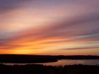 Canada, New Brunswick. Sunset on forest and St. John River.