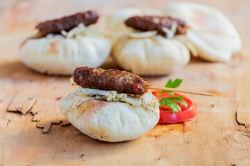 Traditional Adana kebap with Turkish bread bazlama