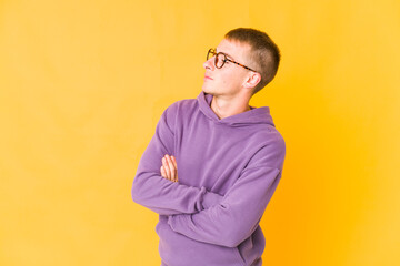 Young caucasian handsome man dreaming of achieving goals and purposes