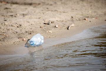 Fototapeta na wymiar Disposable plastic bottle garbage on the beach