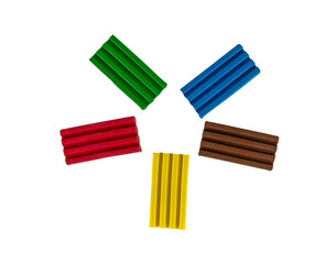 .Pieces of multi-colored plasticine on a white background