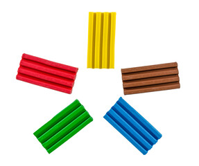 .Pieces of multi-colored plasticine on a white background
