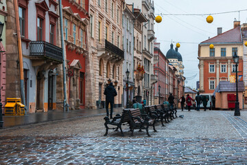 LVIV, UKRAINE: Rainy weather at town Market Square with lamposts and cobbled streets on. Lviv's Old Town is a part of UNESCO World Heritage List © Andrii Marushchynets