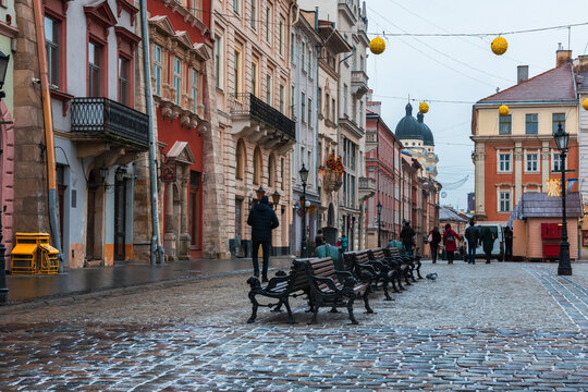 LVIV, UKRAINE: Rainy weather at town Market Square with lamposts and cobbled streets on. Lviv's Old Town is a part of UNESCO World Heritage List