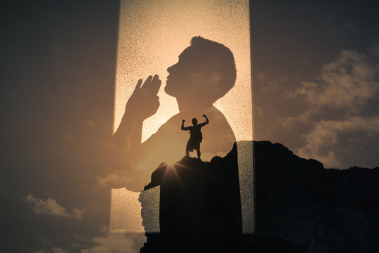 Religious belief, religion, prayer. Man with praying hands praying to god for strength and courage. 