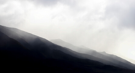 Graphic Dramatic Background Monochrome Mountain Ridges Under Clouds - 414237196