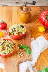 Stuffed baked tomatoes on wooden background