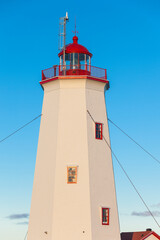 Canada, New Brunswick, Miscou Island. Miscou Lighthouse at sunset.