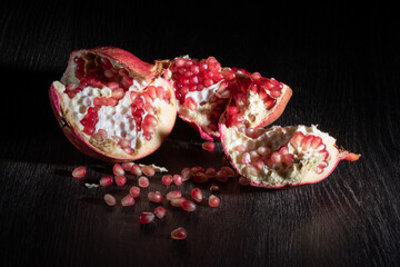fruits pomegranates on a wooden rustic table