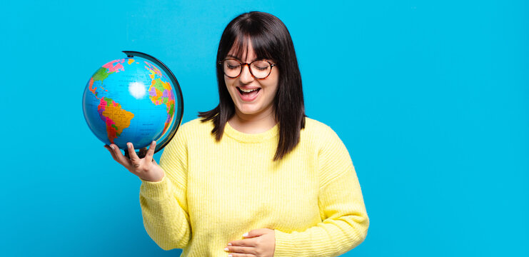 plus size pretty woman laughing out loud at some hilarious joke, feeling happy and cheerful, having fun