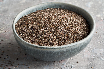 Chia seeds in a blue bowl on a table