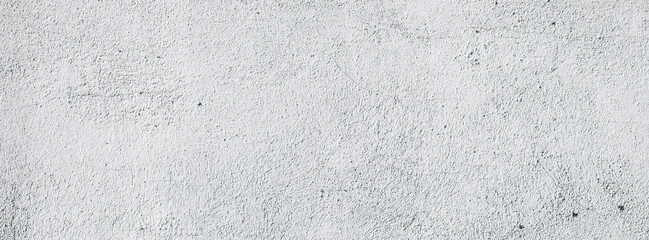 Plastered light gray wall surface background with scratches and cracks. High resolution grungy wall texture. Panoramic banner