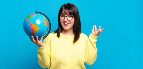 plus size pretty woman feeling happy, surprised and cheerful, smiling with positive attitude, realizing a solution or idea