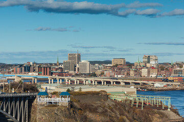 Fototapeta premium Canada, New Brunswick, Saint John. City skyline and the Reversing Falls Bridge.