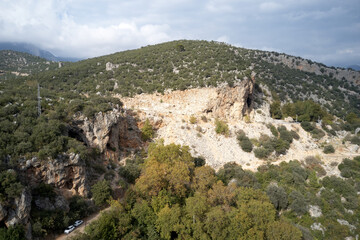 Fototapeta na wymiar Valley with stones on the hillside. Scenic mountains landscape in summer season.