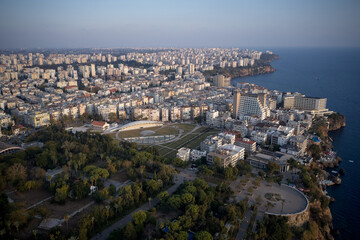 Fototapeta premium Sea coast with buildings on shore. Aerial panoramic view. Antalya, Turkey.