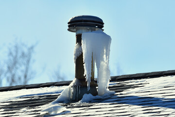 Ice forms on roof vent when  moist exhaust air from home meets very cold outdoor air.