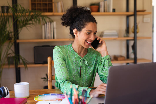 Caucasian Woman Talking On Smartphone, Working From Home